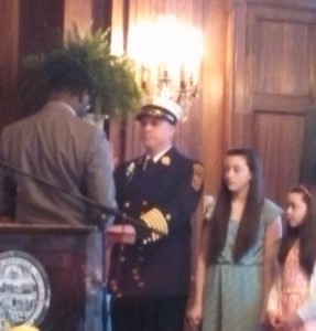 Conant takes the oath from City Clerk Wayman Lee as his daughters look on (WMassP&I)