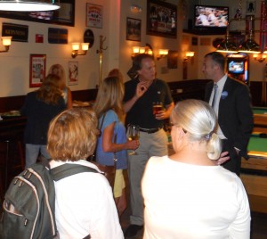 Michael Nichols, far right, talks to voters at Cornwalls (WMassP&I)